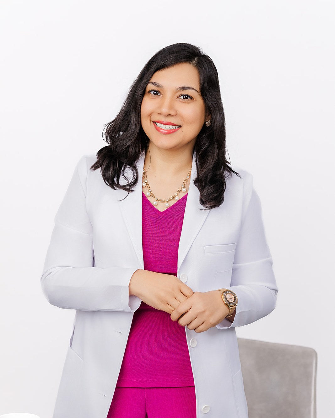 Dr. Bismah Irfan, MD, in her white coat
